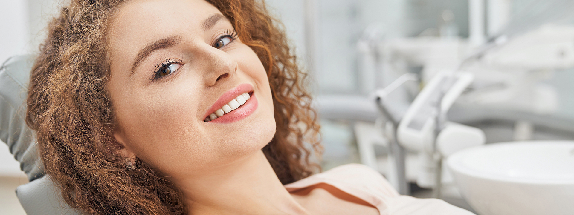 A woman discusses her smile design options with her dentist during a porcelain veneer consultation at La Costa Dental Excellence in Carlsbad, CA