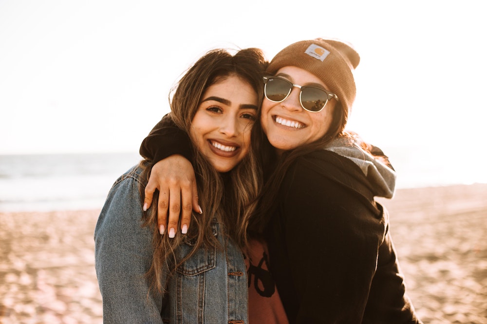 Friends smiling and enjoying time together, supported by comprehensive dental care at La Costa Dental Excellence in Carlsbad, CA