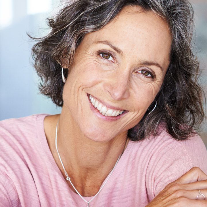 A patient with a brighter smile after professional teeth whitening at La Costa Dental Excellence in Carlsbad, CA